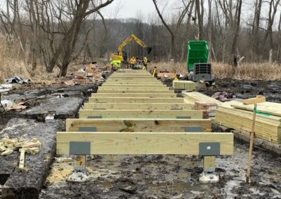 Woodstock Lumber constructing a boardwalk with beams and post caps
